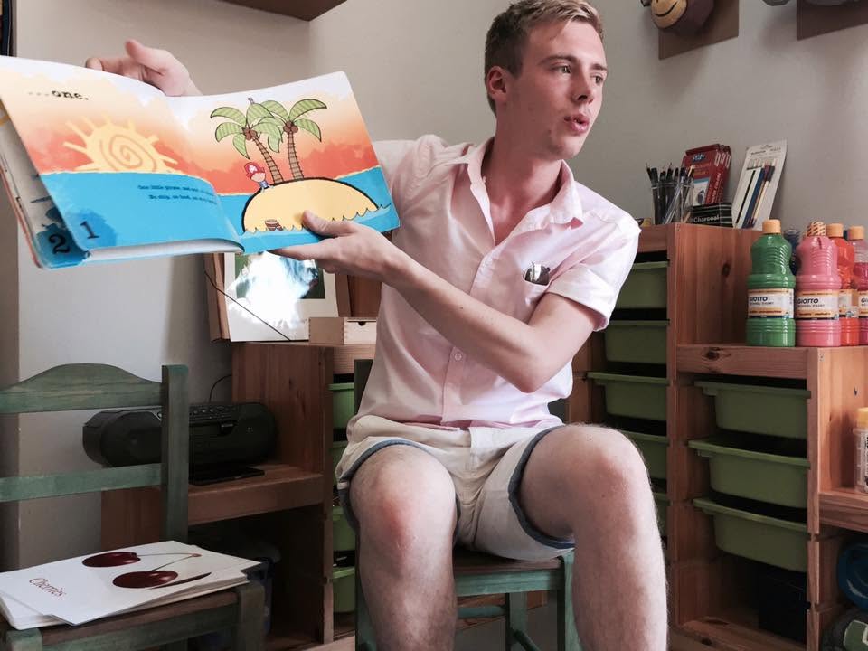 Bright Steps tutor reading an illustrated story book aloud during a session